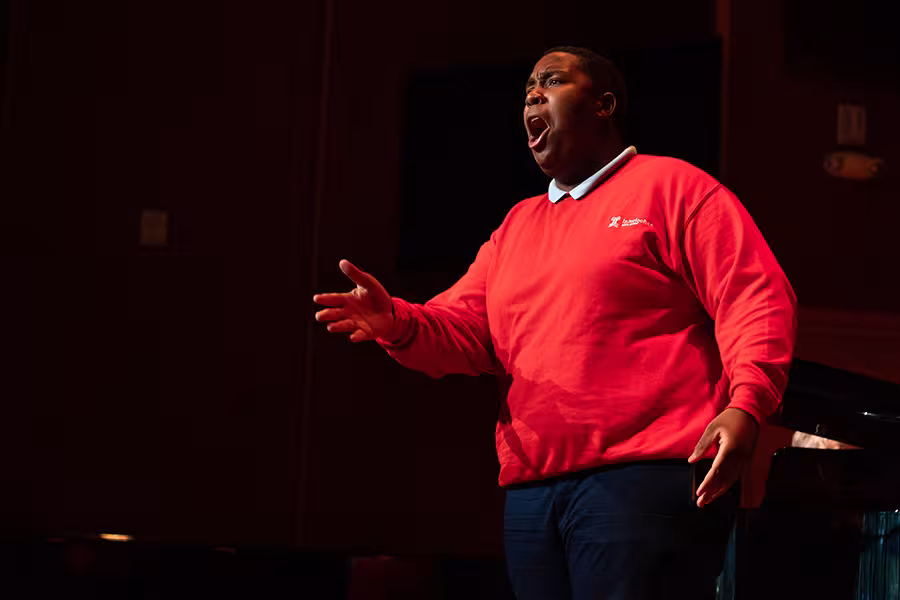 An Interlochen Arts Camp voice student performs in a recital. 