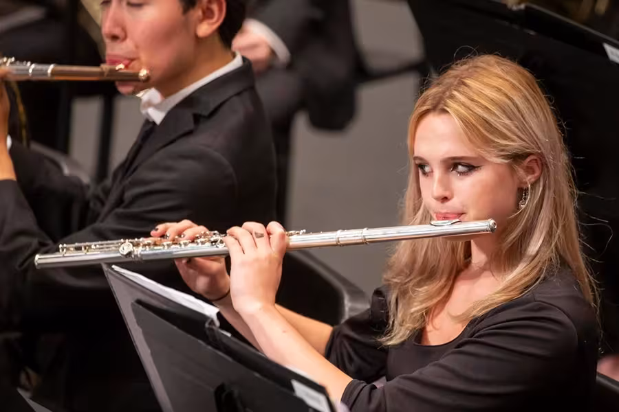 Young land playing the flute