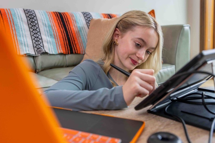 A girl drawing on a tablet