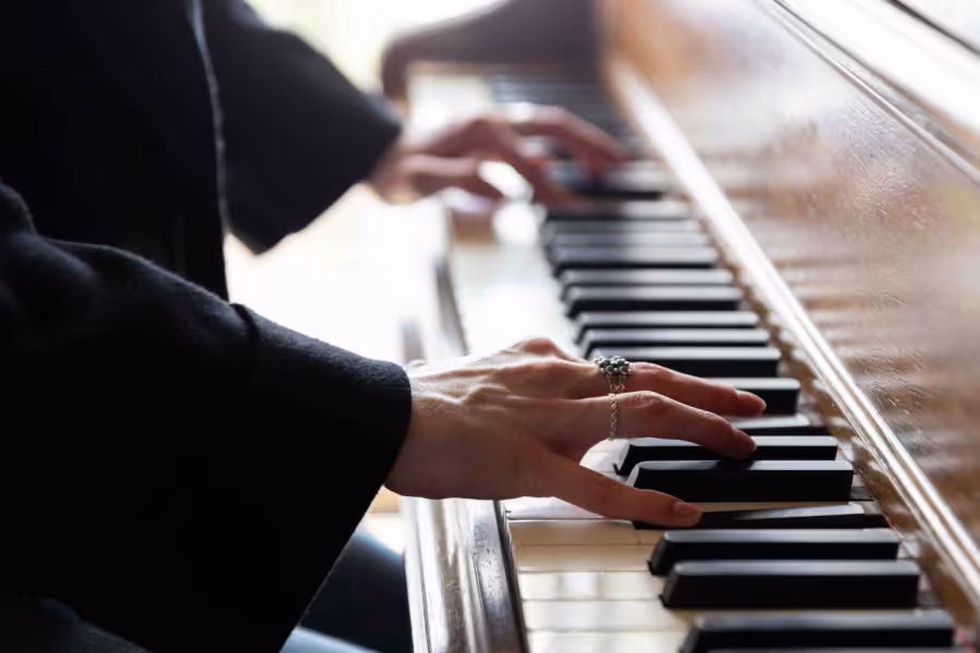 Hands on a piano