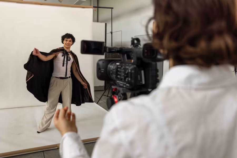 On actor in front of a camera with a director behind.
