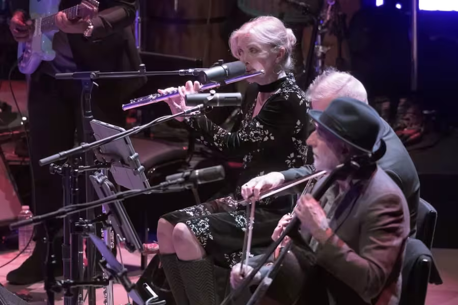 Several musicians perform onstage.