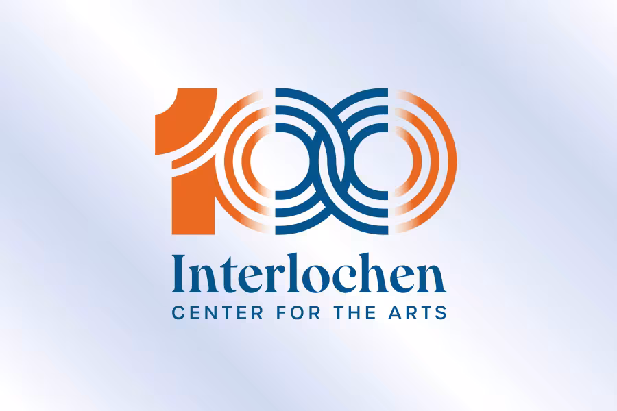 Stylized "100" logo with "Interlochen Center for the Arts" text, celebrating centennial.