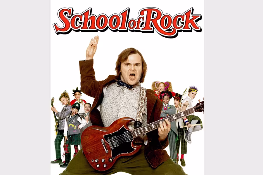 Poster for School of Rock featuring a man in the center playing an electric guitar and raising one hand in a rock gesture. He stands in front of a group of energetic schoolchildren in colorful uniforms and costumes. The title "School of Rock" appears in bold red lettering at the top against a white background.