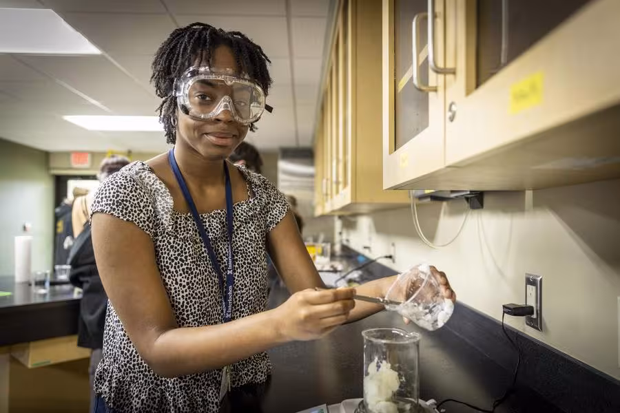An Interlochen Arts Academy students works on a chemistry experiment