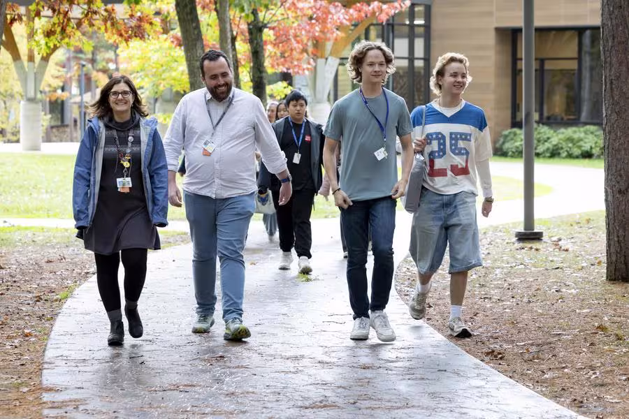 Interlochen faculty and staff walk with students on campus