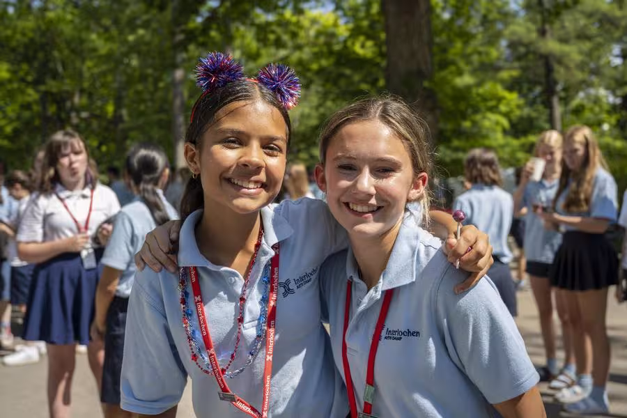 Two Intermediate campers pose for a picture during the Fourth of July parade. 