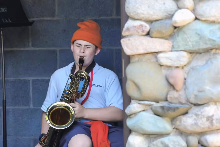 A saxophonist jams out in one of Interlochen’s many practice cabins