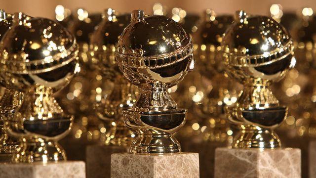 A table full of Golden Globe Awards