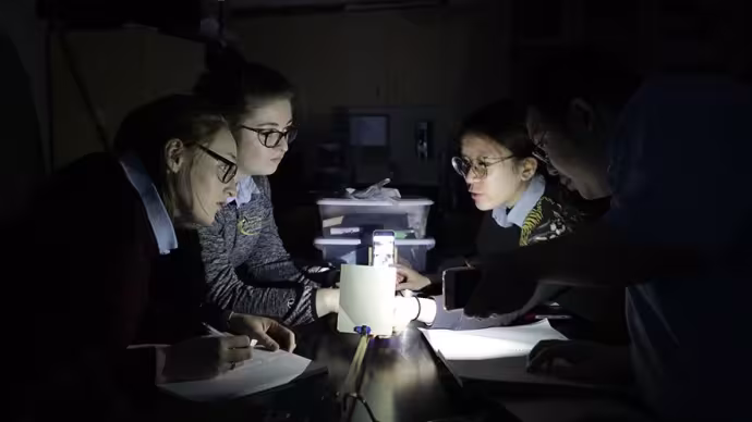 Arts Academy students conduct a physics experiment