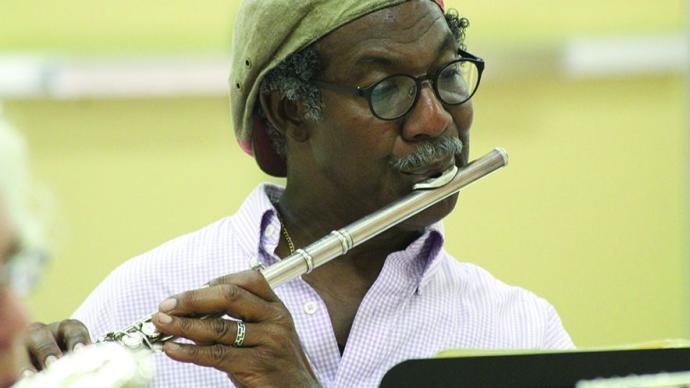 A man plays the flute