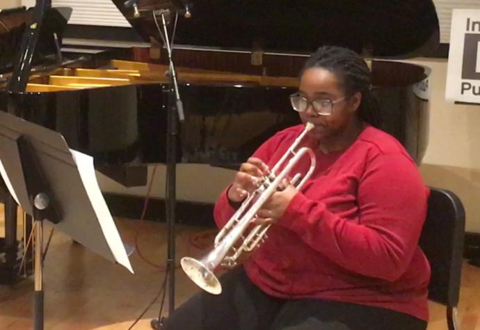 An Interlochen Arts Academy senior plays trumpet