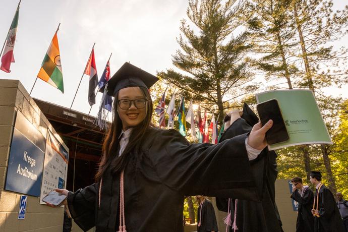 An Interlochen Arts Academy graduate heads to Kresge Auditorium for Honors Convocation