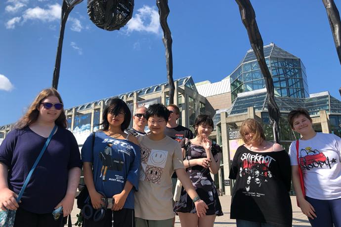 Arts Academy animation students and Director of Film & New Media Michael Mittelstaedt pose outside the National Gallery of Canada
