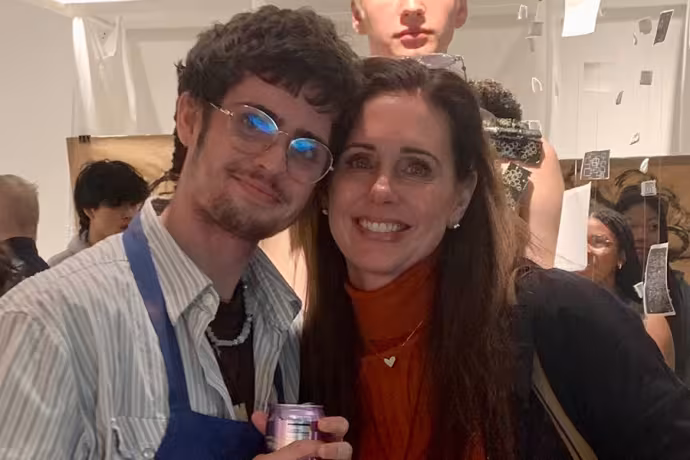 Lukas Drysdale and his mother at a gallery opening in the Dow Center for Visual Arts