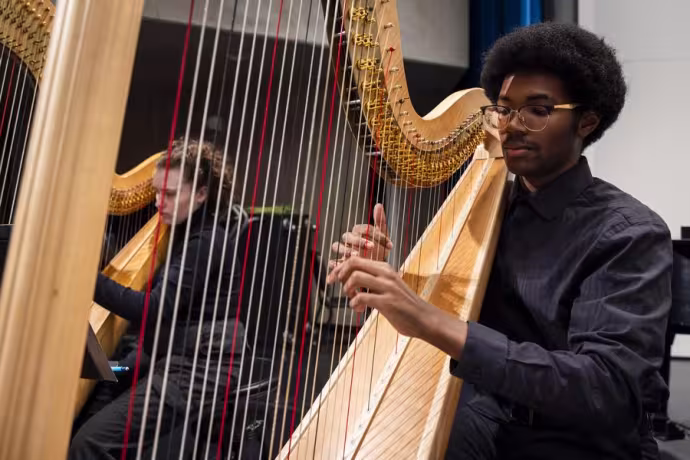 Interlochen Arts Academy harp student performs in orchestra