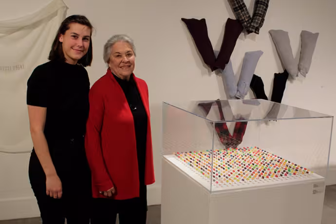 Donor Joanne Sprouse with one of the recipients of the scholarship she created at an event in the Visual Arts gallery.