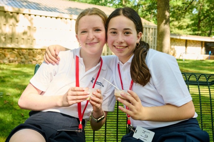 Two students eat ice cream at Melody Freeze