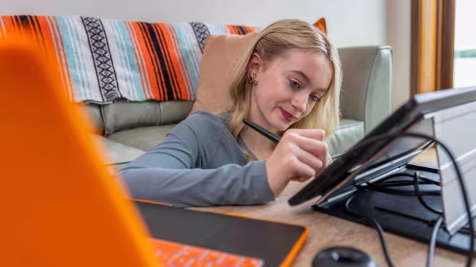 A girl drawing on a tablet