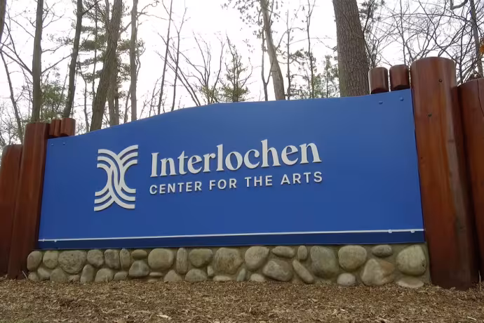 Sign at front of campus reading "Interlochen Center for the Arts"
