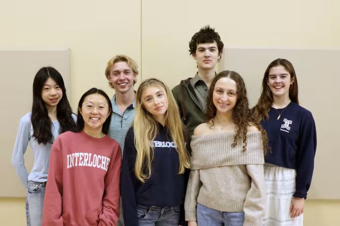 A group of Interlochen students smile at the camera.