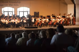 Dr. Leslie Dunner conducts the World Youth Symphony Orchestra.