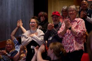 An Interlochen employee reacts to being selected as one of the 2023 employee award recipients