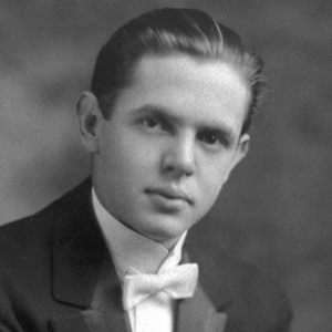 Black and white portrait of a young Joseph E. Maddy in formal attire with a bow tie.