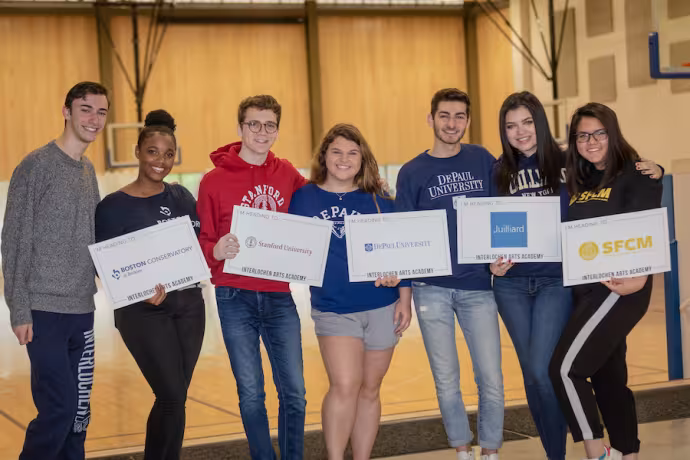 Group of Interlochen Arts Academy students showing where they will be going to college