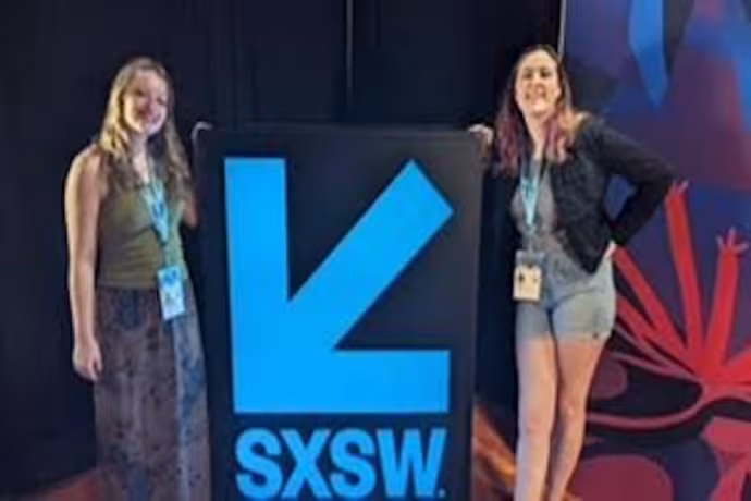 2 Jedo's cast crew posing with SXSW sign