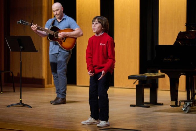 Arts Camp student performs with faculty