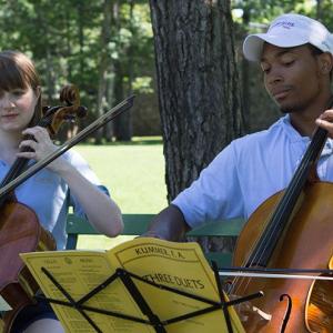 Two cellists practice a duet at Interlochen Arts Camp.