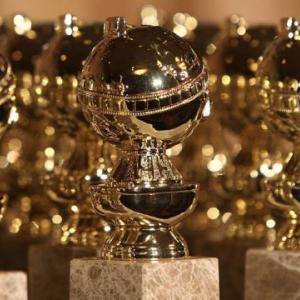 A table full of Golden Globe Awards