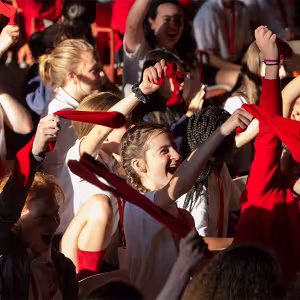 Intermediate students wave socks during First Gathering