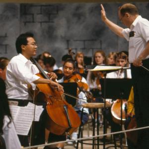 Henry Charles Smith III conducts Interlochen’s World Youth Symphony Orchestra with guest Yo-Yo Ma in 1995.