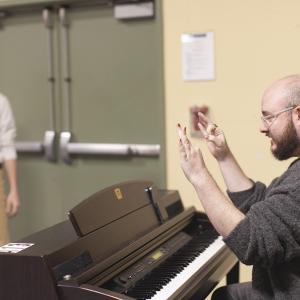 Instructor of Voice Doug Peck works with a musical theatre student.