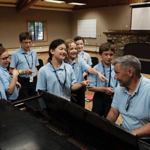 Camp students practicing a song
