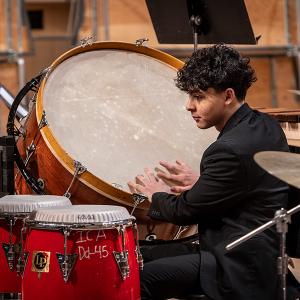 An Interlochen Arts Academy percussion student plays a bass drum