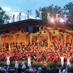 a photo of the summer arts camp's orchestra and dancers performing together