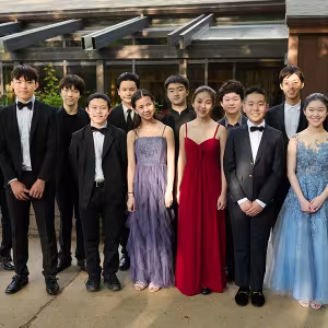 The Lang Lang Young Scholars pose in front of Interlochen’s Dendrinos Chapel and Recital Hall before their end-of-session concert. 