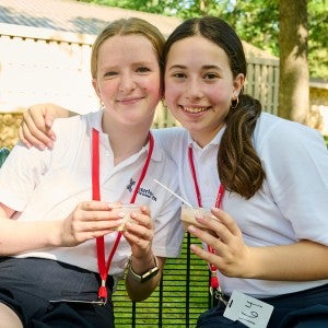 Two students eat ice cream at Melody Freeze