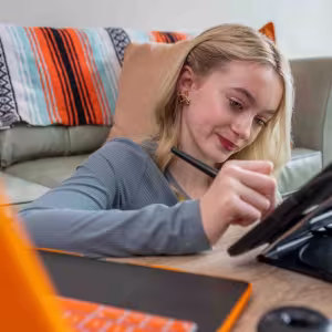 A girl drawing on a tablet