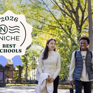Two students walk on Interlochen's campus. The image is overlaid with a badge reading "2026 NICHE Best Schools."