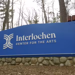 Sign at front of campus reading "Interlochen Center for the Arts"