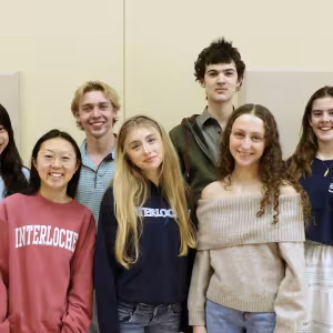 A group of Interlochen students smile at the camera.