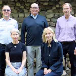 The 2026 board of trustees pose for a photo in front of a stone wall. Standing in the back row is Ozzy Oguz, Chris Sogard, David Inglish. Standing in the front row is Paula Jo Kemler, Lisa Laplace.